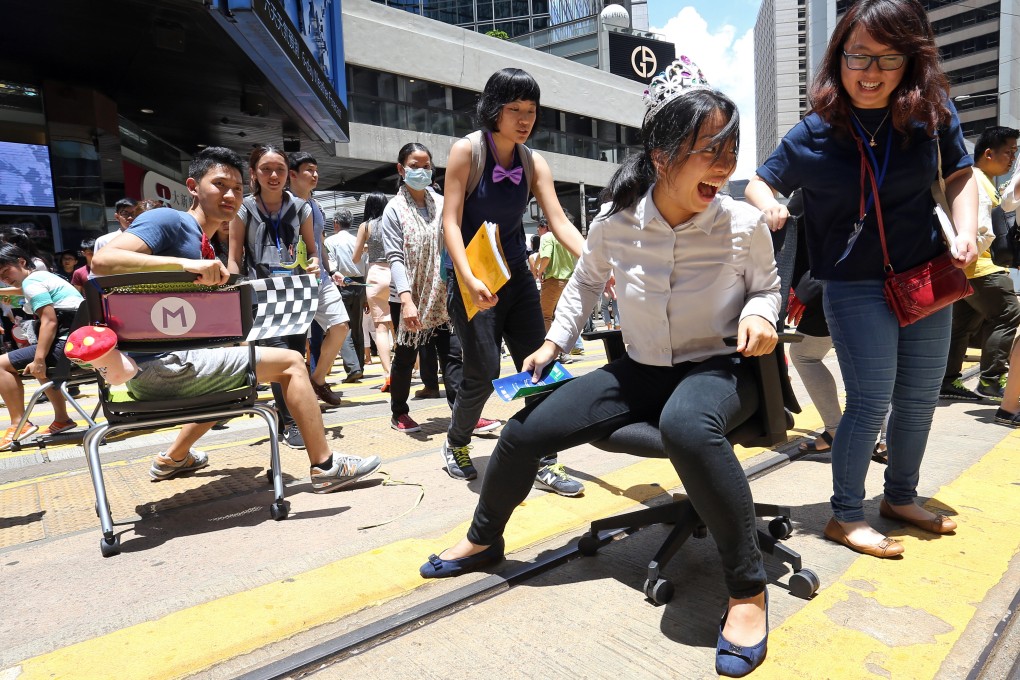 Campaigners from a non-profit group take part in an event in Hong Kong’s Central district in June 2016, to raise awareness of air pollution and call for pedestrianisation. Photo: Dickson Lee