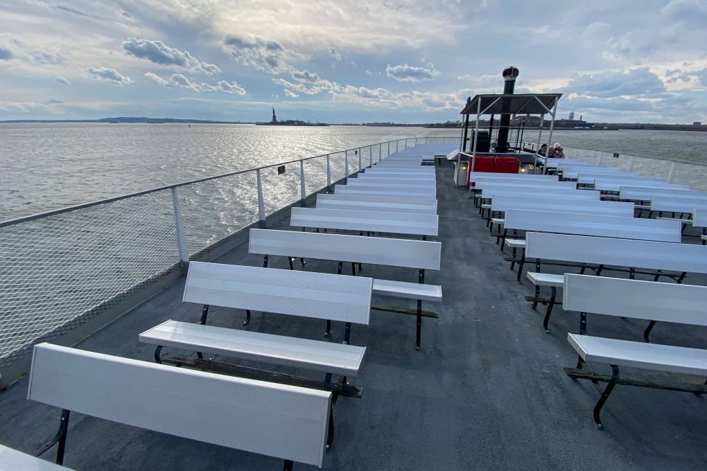 Empty benches on a ferry from the Statue of Liberty in New York City. Photo: Kena Betancur/AFP