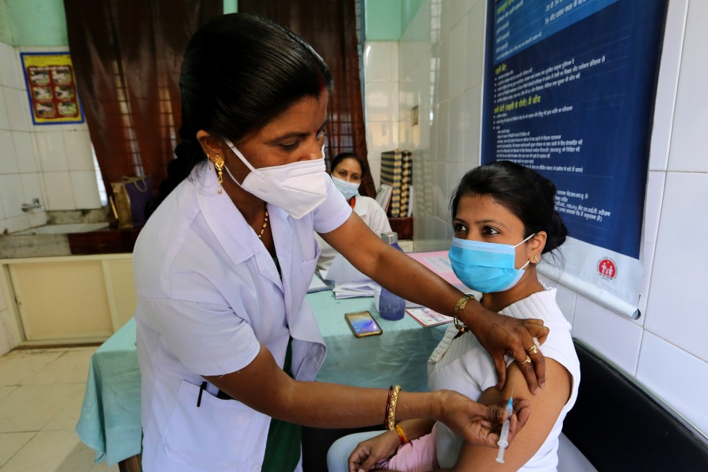 A woman receives a shot of a Covid-19 vaccine in Bhopal, India, on March 6. India, South Africa and other countries have proposed that the WTO exempt member countries from enforcing some patents and other intellectual property rights for a limited period to help countries contain Covid-19. Photo: EPA-EFE