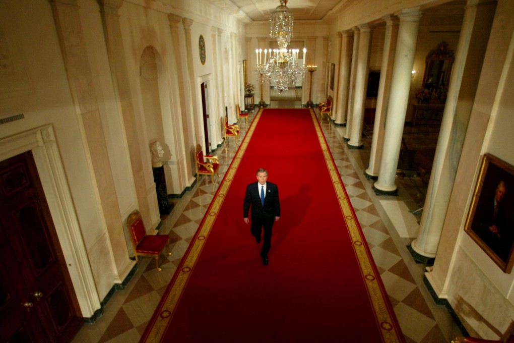 Then US president George W. Bush walks down the hall of the White House before a news conference on March 6, 2003, in which he said the US would push for a UN resolution authorising war if Iraq did not comply with disarmament obligations. The US commenced military action on March 19. Photo: Reuters