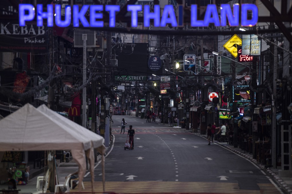 A deserted Bangla Walking Street at Patong Beach, Phuket, in January. Businesses on the tourism-dependent Thai holiday island want most people there vaccinated against coronavirus in time to open for high season, which starts in November. Photo: Sirachai Arunrugstichai/Getty Images