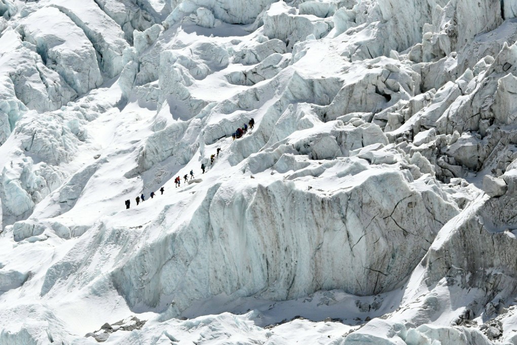 Climbers cross the Khumbu icefall of Mount Everest. The route across is prepared at the start of the climbing season by highly skilled Nepalese mountaineers. Photo: AFP/Prakash Mathema