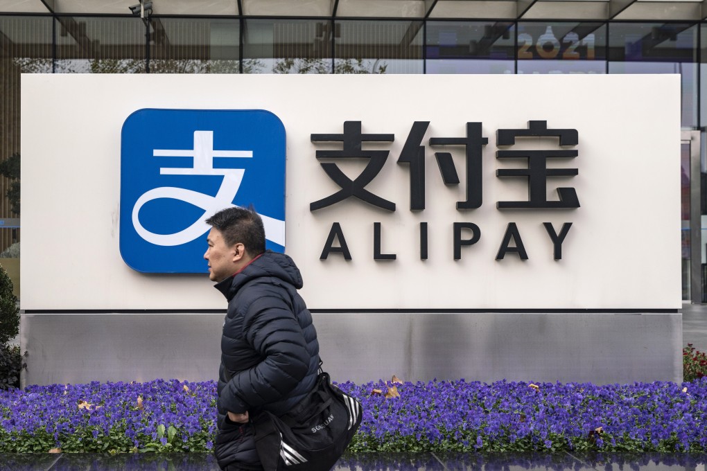 A pedestrian walks past an Alipay sign outside an Ant Group office building in Shanghai, China, on December 24, 2020. Photo: Bloomberg