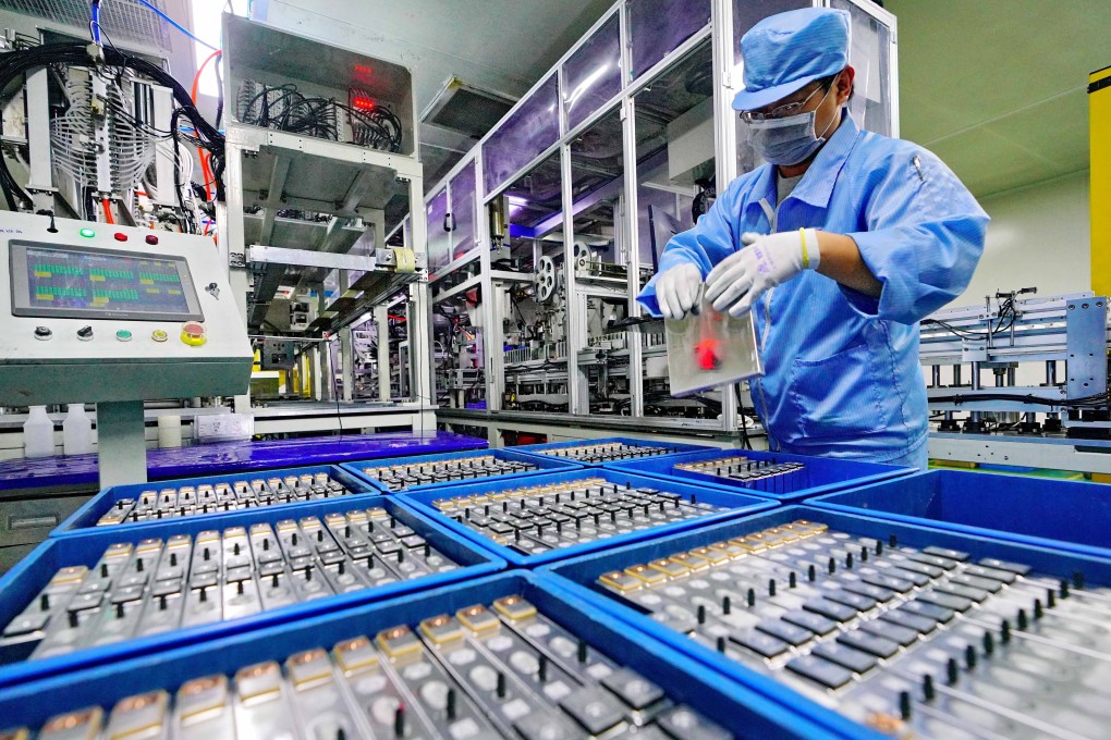 A worker is seen on a production line at a lithium battery manufacturing plant for automotive use in Tangshan in northern Hebei province. Photo: Xinhua
