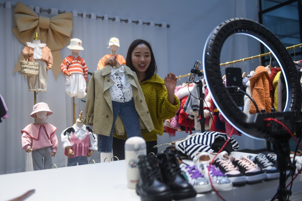 A live-streamer sells children’s clothes in Zhili town, Huzhou, Zhejiang province, on February 8. Live-streaming, group buying and new forms of social shopping are emerging in Asia as e-commerce explodes. Photo: Xinhua