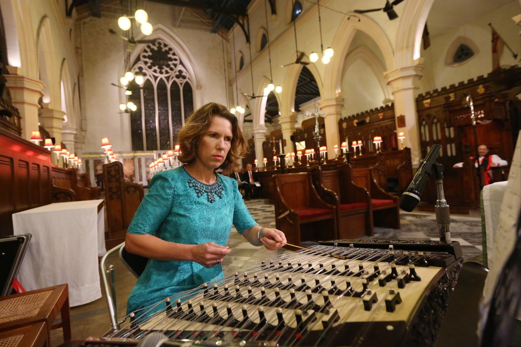 Ambassador Caroline Wilson, then consul-general to Hong Kong and Macau, plays the yangqin during a thanksgiving service at St John’s Cathedral in commemoration of the 70th anniversary of the end of World War II in the region, in August 2015. Photo: Staff