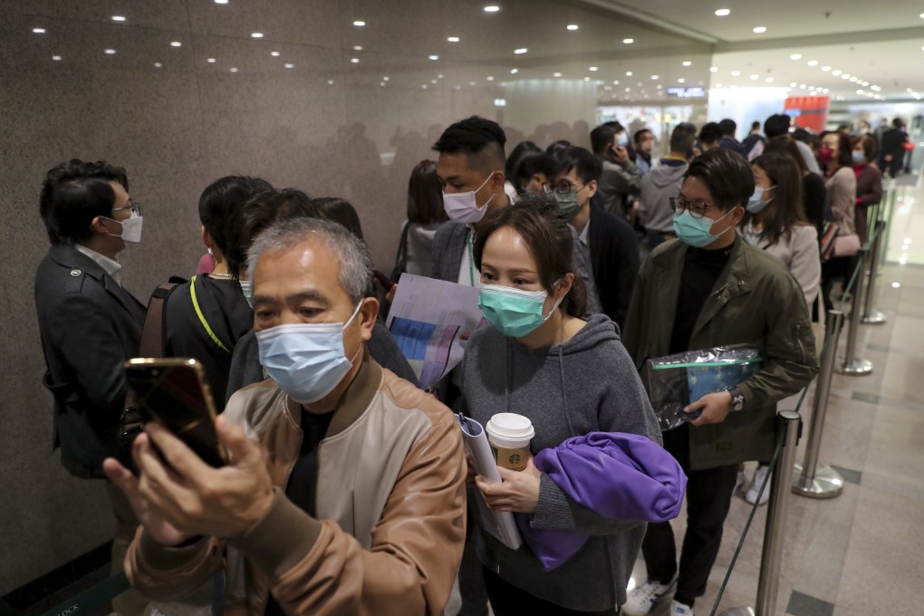 Potential buyers line up for newly launched flats at the project’s sales office in Tsim Sha Tsui on February 27. Photo: Edmond So