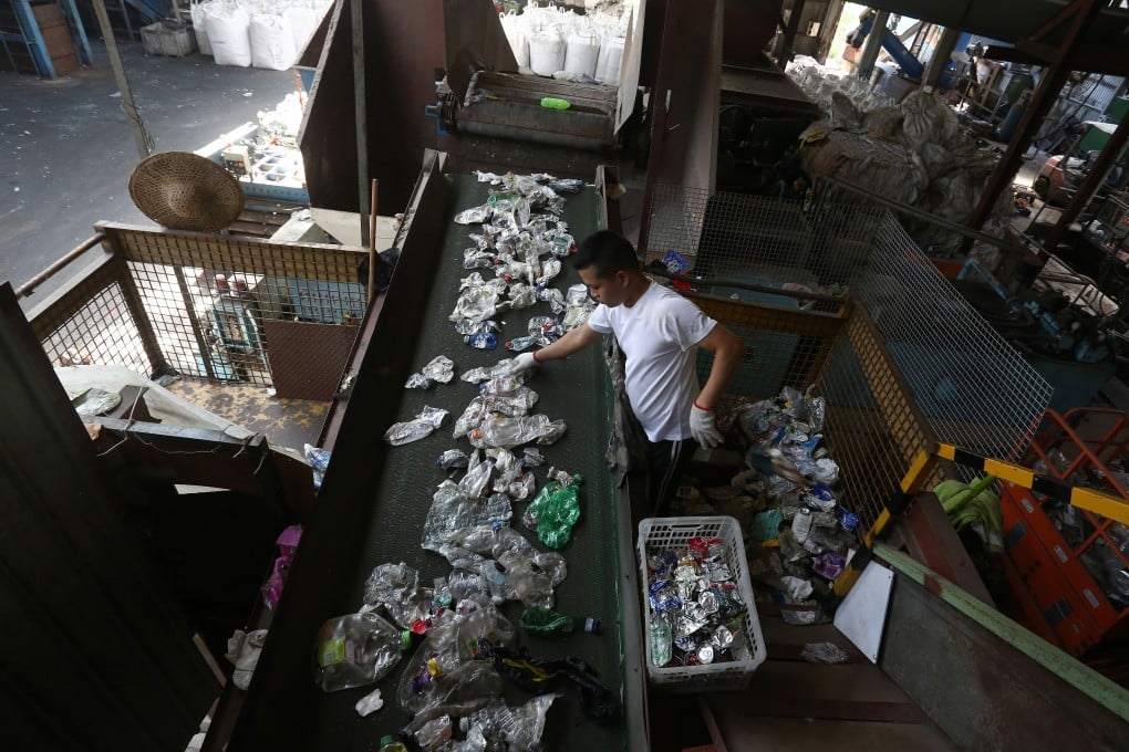 An employee sorts through collected plastic at a recycling factory in Lung Kwu Tan, Tuen Mun, Hong Kong, on June 18, 2020. Photo: Jonathan Wong