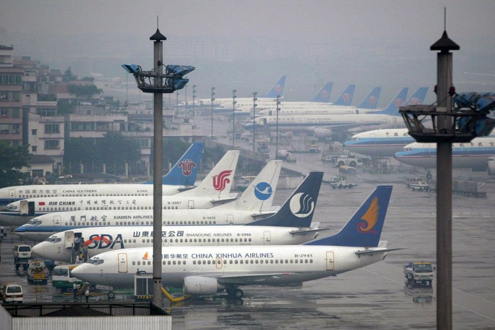 Passenger jets are parked at the Baiyun International Airport in Guangzhou. Photo: Reuters