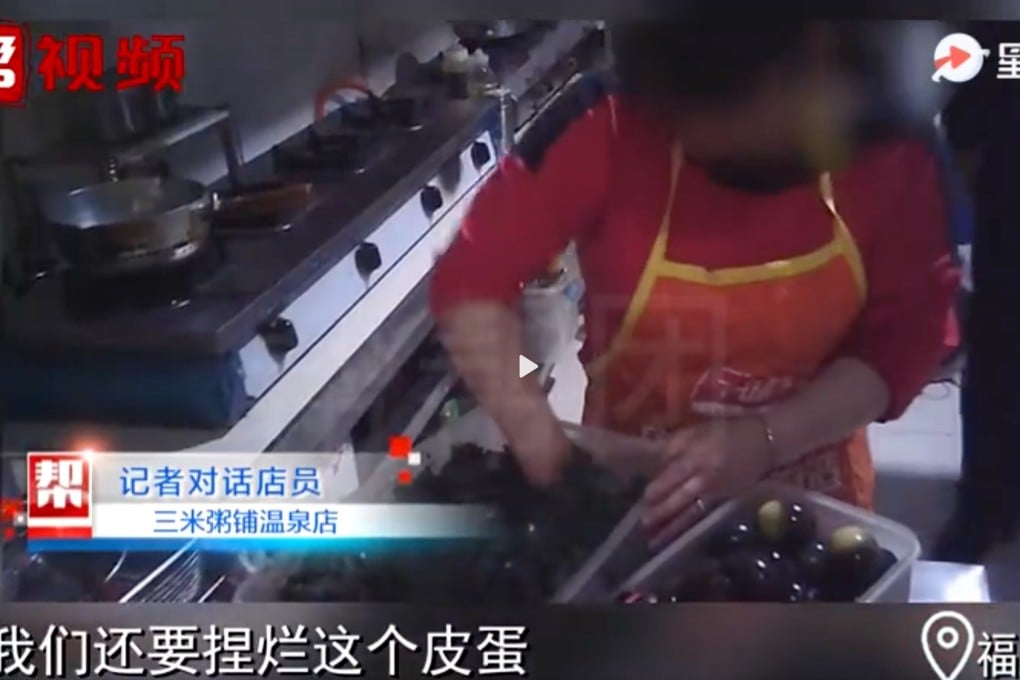A kitchen worker at a Man Lin congee restaurant rummages through partially eaten leftovers looking for food to re-serve to customers. Photo: Fujian Television