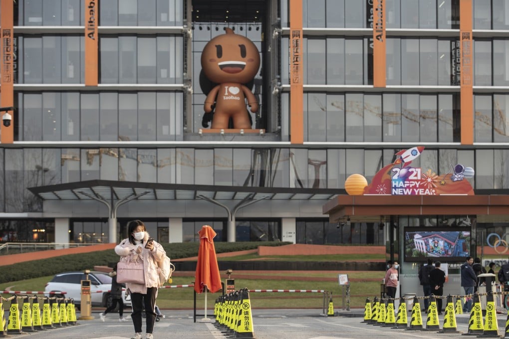 An employee exits Alibaba Group Holding’s headquarters in Hangzhou on January 20, 2021. Photo: Bloomberg