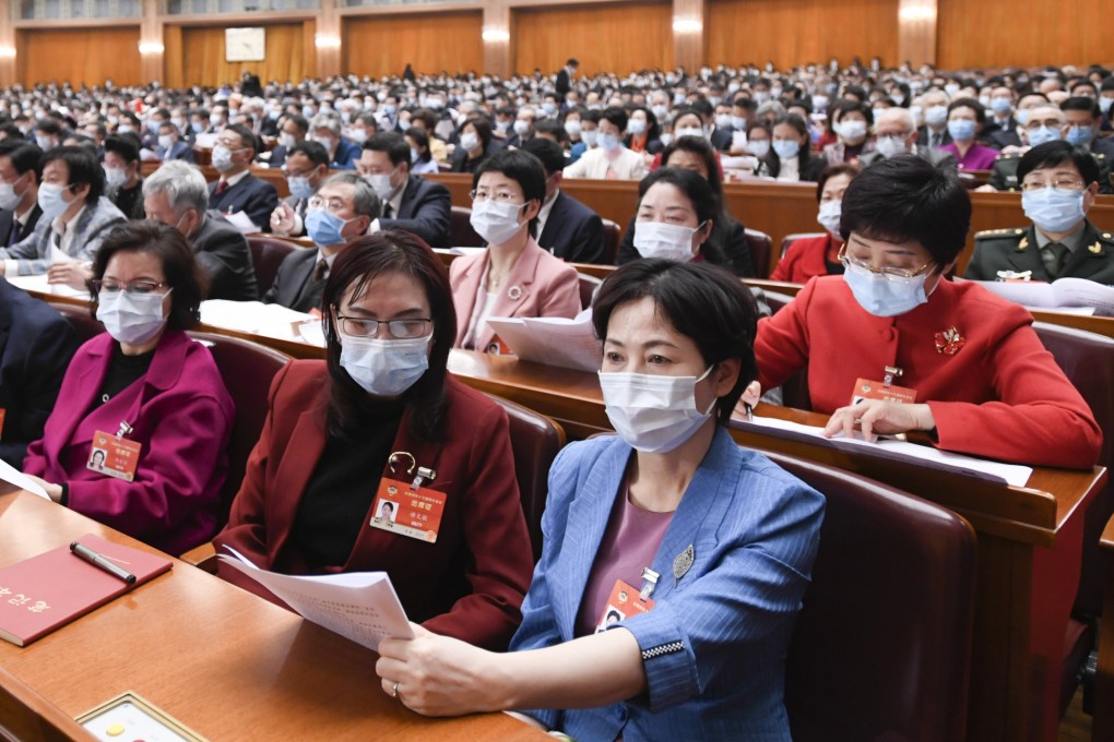 Women attend a meeting of the 13th CPPCC National Committee at the Great Hall of the People in Beijing on March 4. Photo: Xinhua