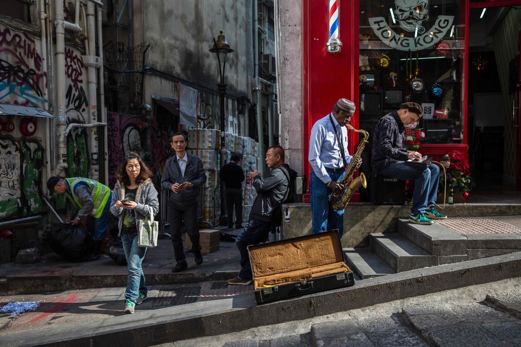 Buskers play Christmas tunes in Central, Hong Kong, in 2016. Photo: AFP