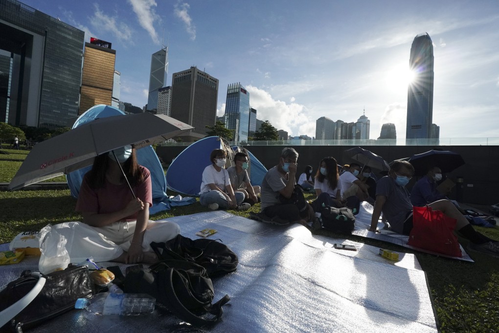 Members of concern groups focused on housing for low-income households, subdivided flats and social security aid stage a protest at Tamar Park in Admiralty, urging the Hong Kong government to tackle poverty and homeless, on July 5 last year. Photo: Felix Wong