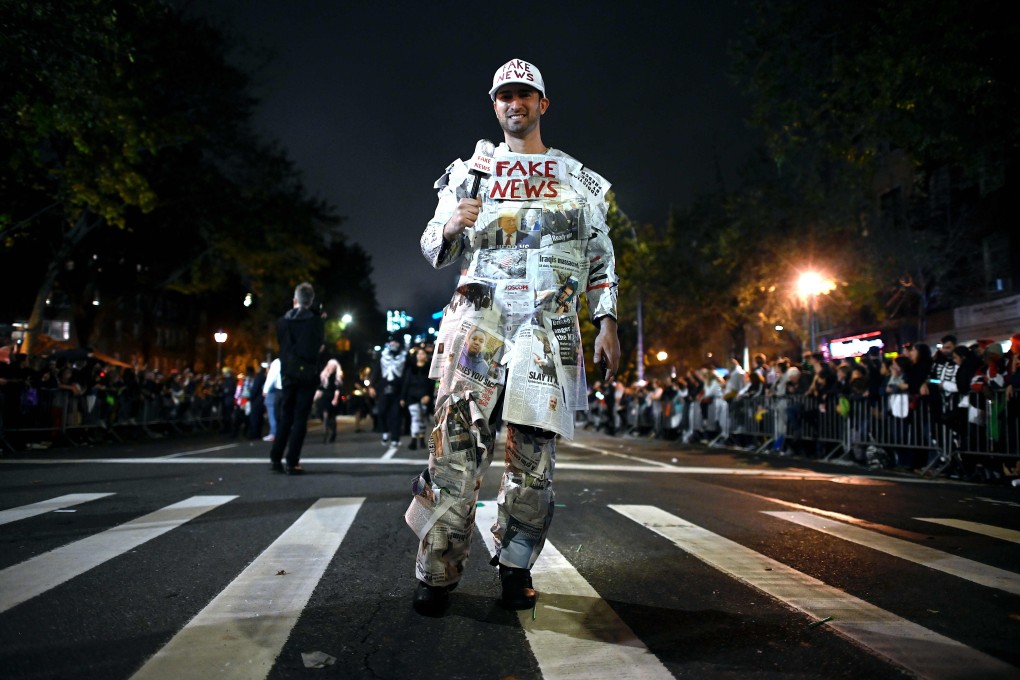 A man dresses up as “Fake News Media” in the annual Village Halloween parade on Sixth Avenue, New York, on October 31, 2019. Photo: AFP