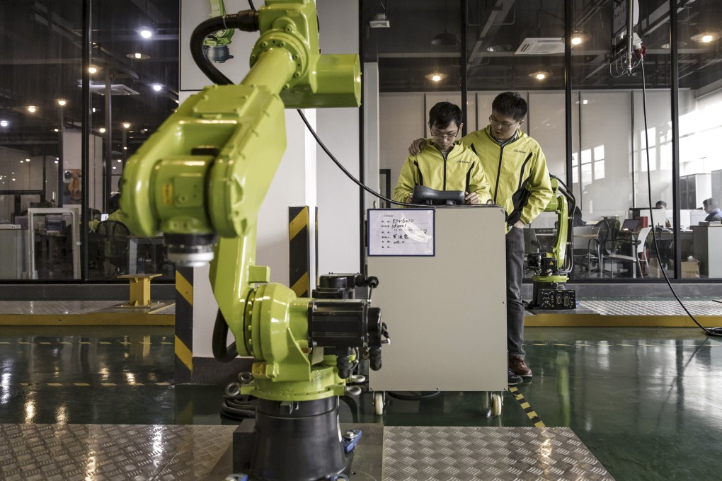 Technicians work at E-Deodar Robot Equipment’s factory in Foshan. The Greater Bay Area city has come up with incentives to draw start-ups and skilled workers. Photo: Bloomberg