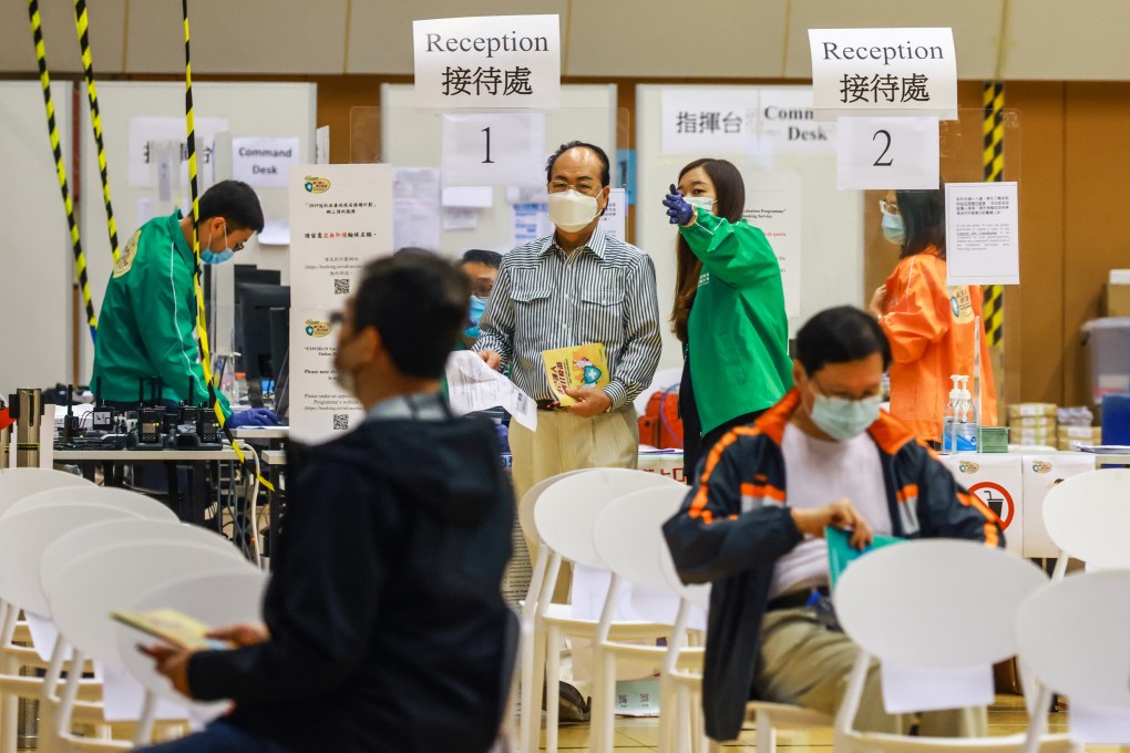 People get ready to receive the BioNTech vaccine at a community vaccination centre at the Hiu Kwong Street Sports Centre in Kwun Tong on March 16. Photo: May Tse