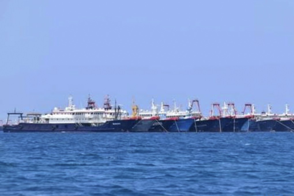 In this Sunday, March 7, 2021, photo provided Sunday, March 21, 2021, by the Philippine Coast Guard/National Task Force-West Philippine Sea, some of the 220 Chinese vessels are seen moored at Whitsun Reef, South China Sea. The Philippine government expressed concern after spotting more than 200 Chinese fishing vessels it believed were crewed by militias at a reef claimed by both countries in the South China Sea, but it did not immediately lodge a protest. (Philippine Coast Guard/National Task Force-West Philippine Sea via AP)