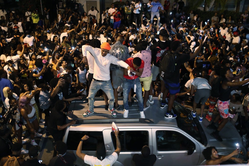 Miami Beach was still packed with raucous partiers after an 8pm curfew went into effect. Photo: AFP