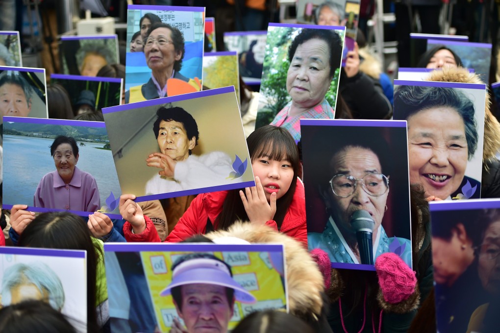 South Korean supporters hold portraits of former “comfort women”, who were coerced into working in brothels for Japanese soldiers during World War II, during a rally outside the Japanese embassy in Seoul in 2015. Photo: AFP