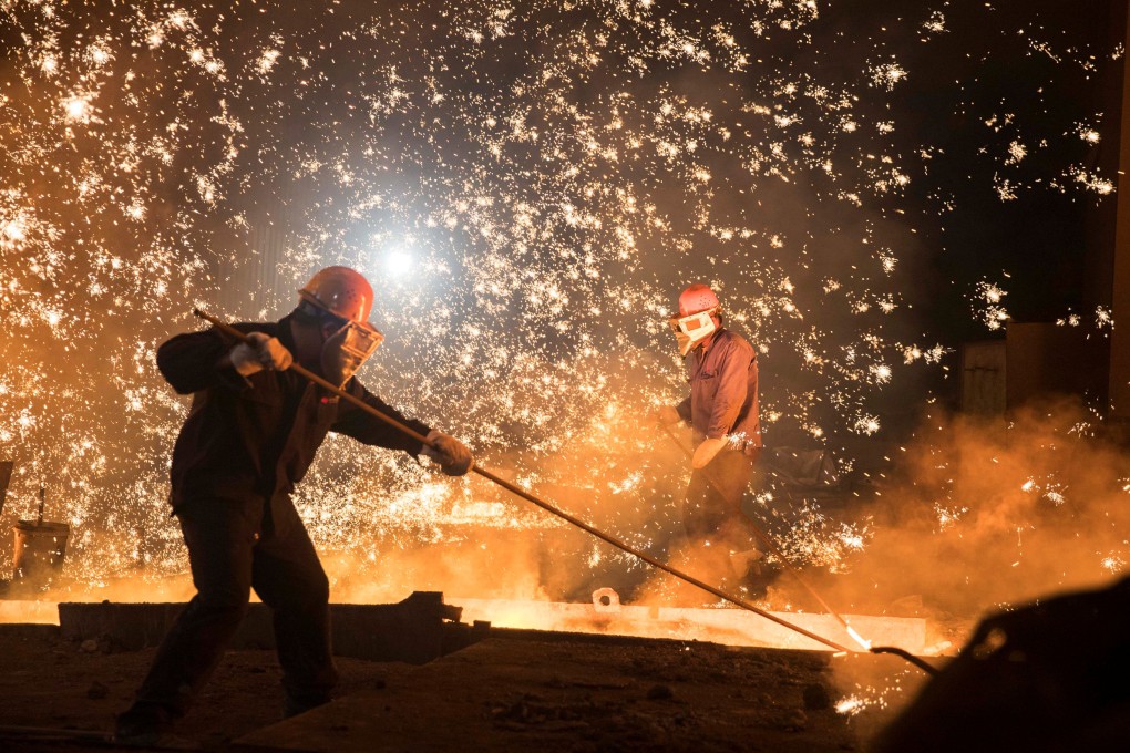 Labourers work at a steel plant in Jinan in China’s Shandong province in July 2017. Increased demand for iron ore might underpin demand for the Australian dollar. Photo: Reuters