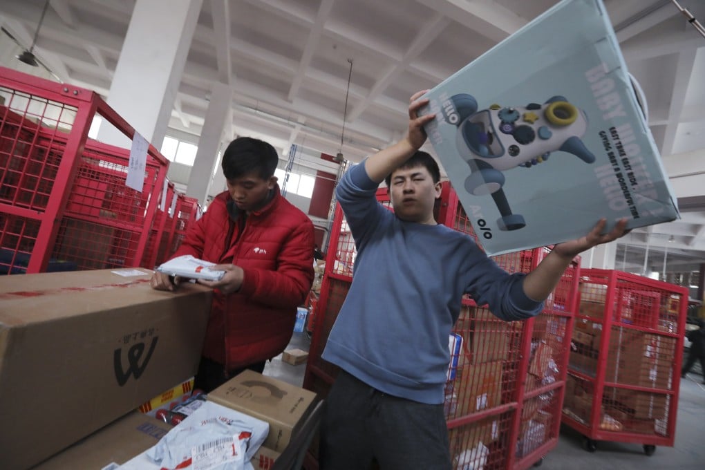 Workers sort out packages for delivery at JD’s Yizhuang Smart Delivery Station in Beijing, Nov 11, 2020. Photo: SCMP/Simon Song