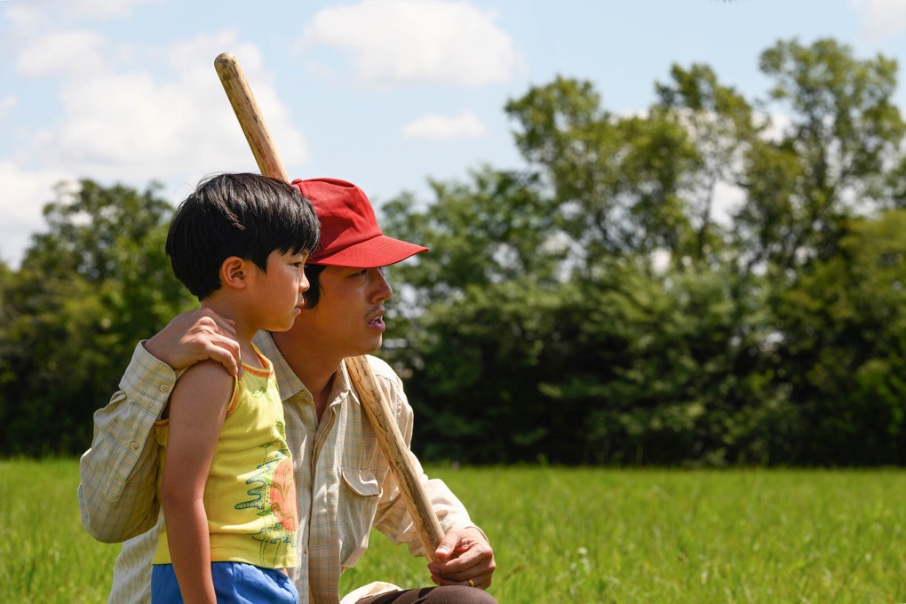 Steven Yeun, right, in "Minari" with Alan Kim by Lee Isaac Chung. (Courtesy of Sundance Institute/TNS)