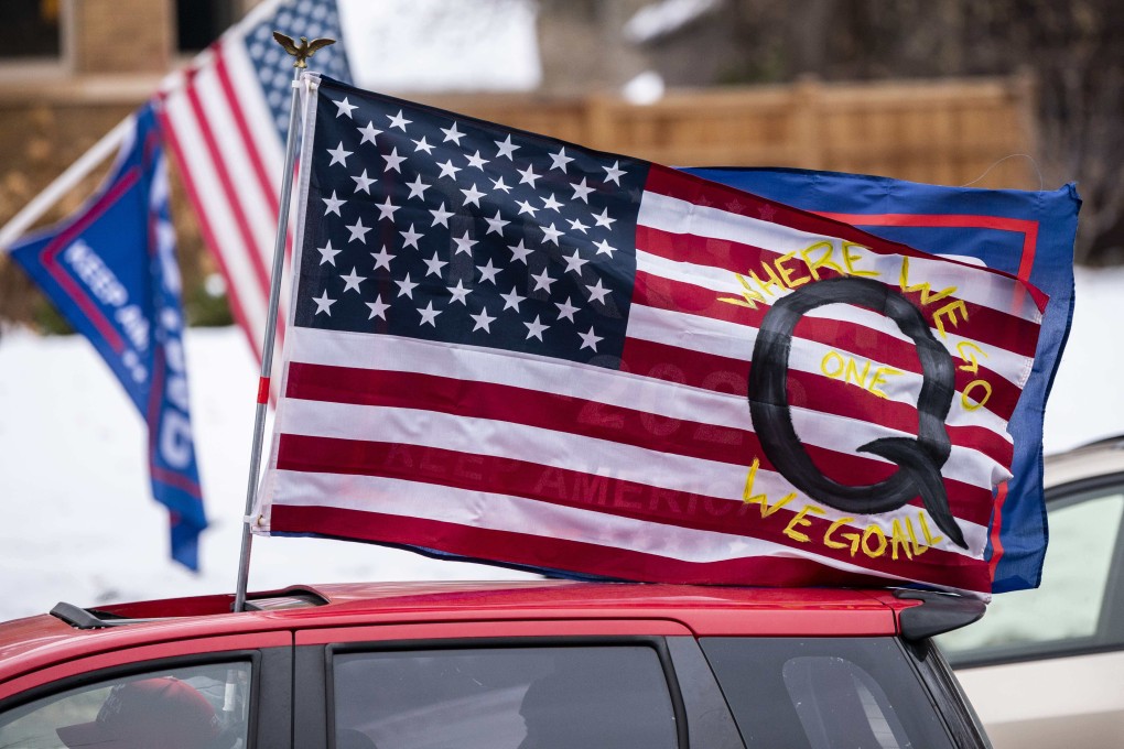 A car with a QAnon flag seen at a Trump rally in November. Photo: Getty Images via AFP