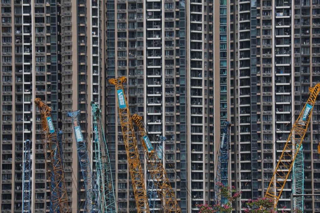 Cranes are seen in front of a building in Tiu Keng Leng in May 2020. The 15 government sites listed in this year’s land supply programme for private housing can only supply 6,000 flats. Photo: Xiaomei Chen