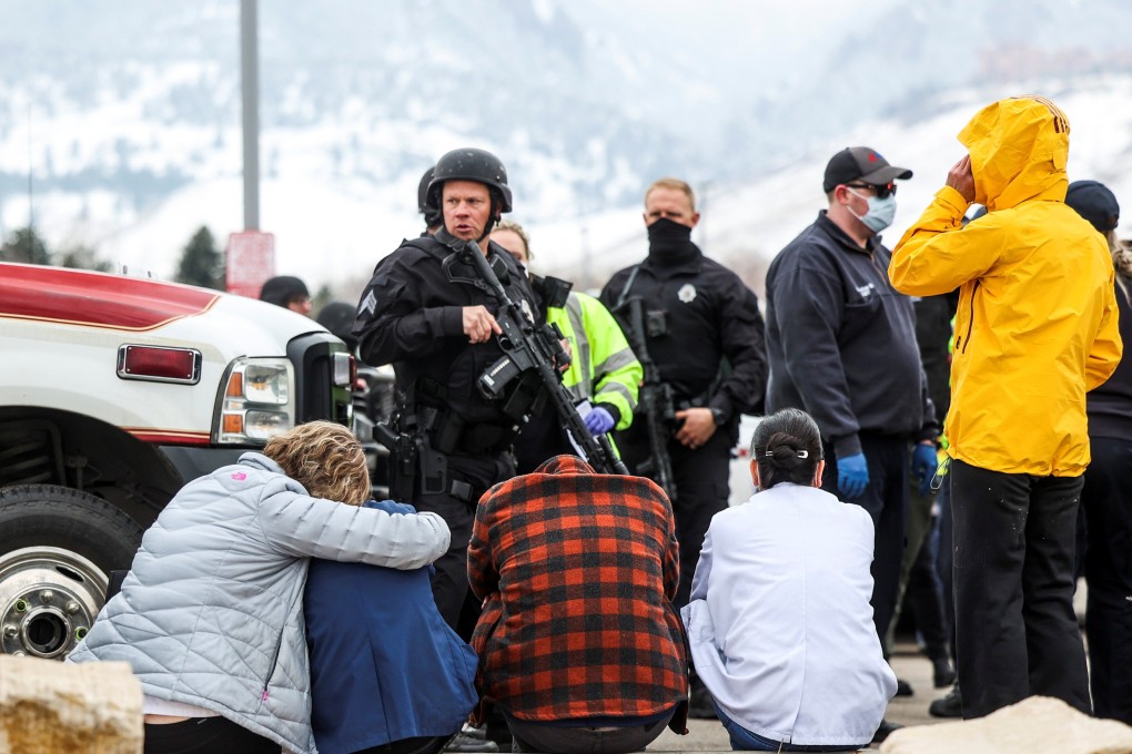 Police guard people evacuated from the site of a mass shooting in Boulder, Colorado, on Monday. Photo: Michael Ciaglo/USA Today Network via Reuters