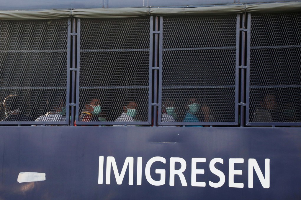Myanmar migrants to be deported from Malaysia are seen inside an immigration truck in February. Photo: Reuters