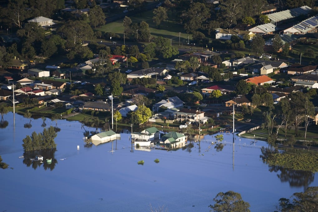 Homes are seen partially submerged northwest of Sydney, Australia, on March 24, 2021. Photo: AP