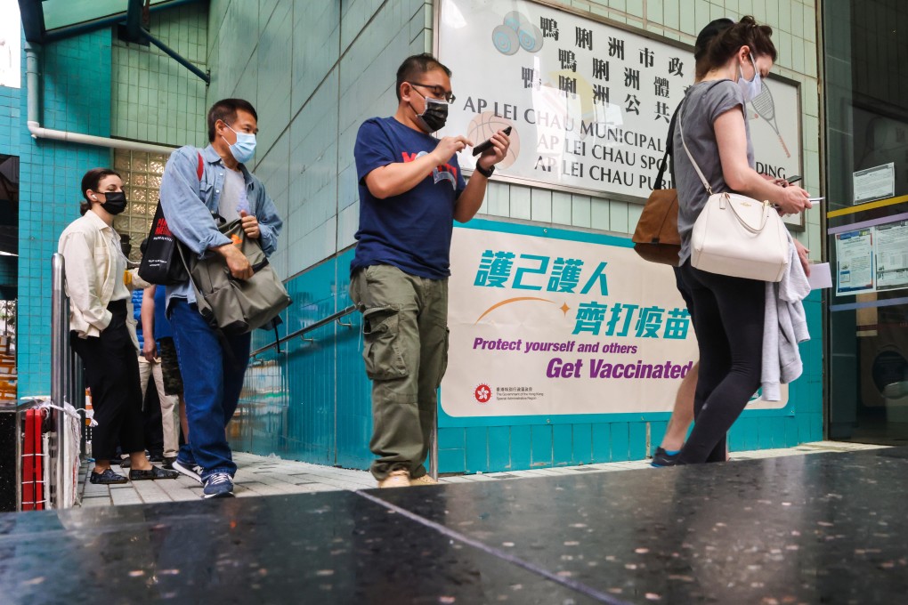 People line up to receive the BioNTech jab at the community vaccination centre at Ap Lei Chau Sports Centre. Photo: K. Y. Cheng