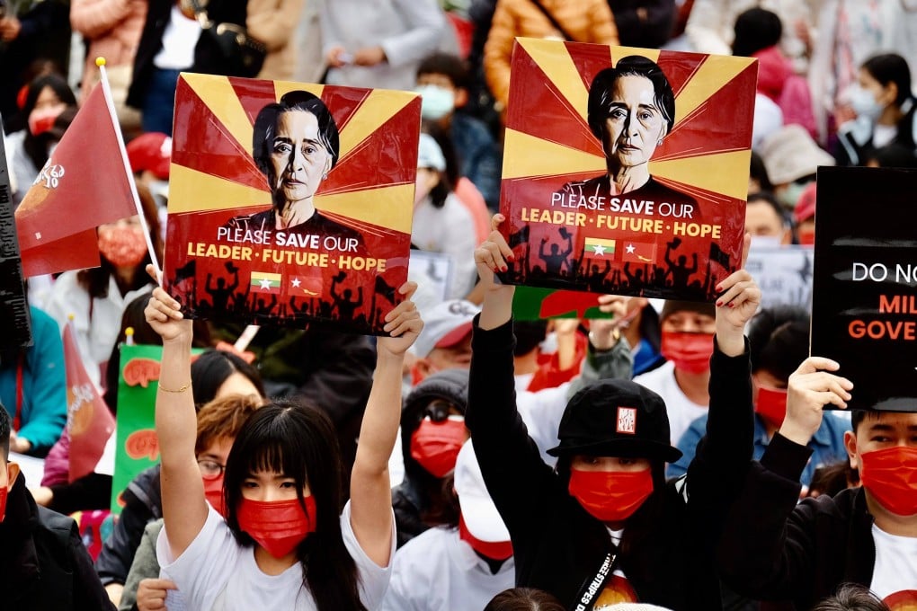 Myanmar nationals in Taiwan display portraits of ousted leader Aung San Suu Kyi during a protest. Photo: AFP