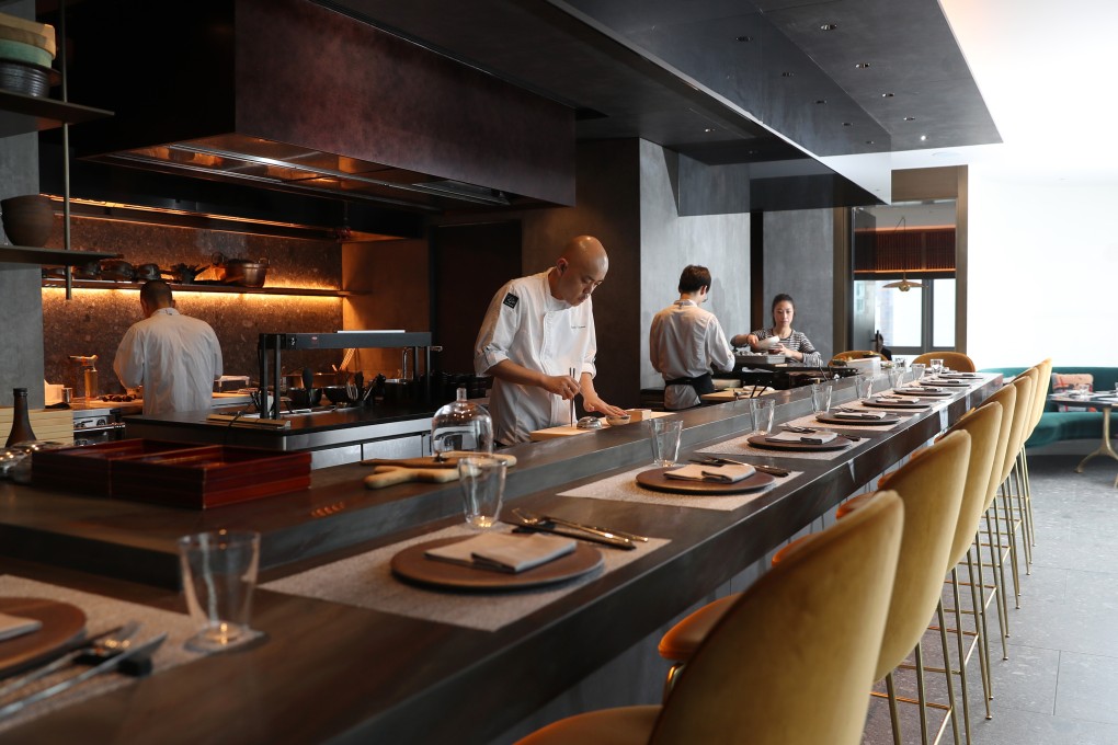 Ryota Kanesawa, centre, head chef of Ryota Kappou Modern. Photo: Winson Wong