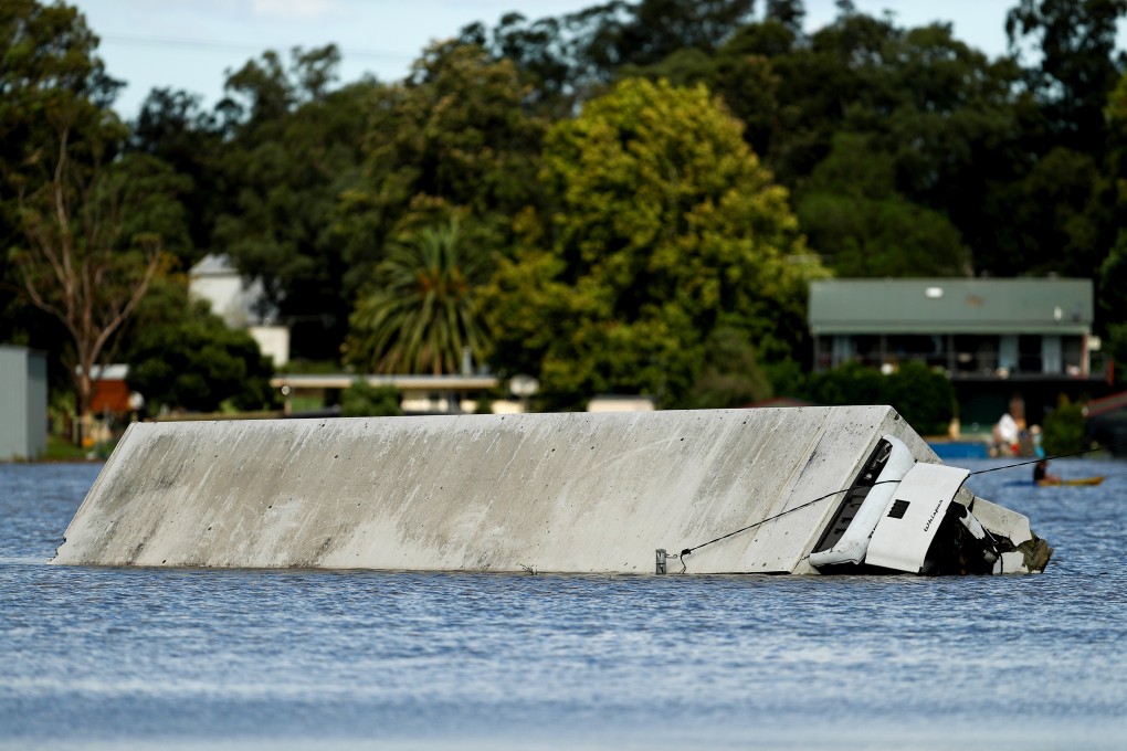 A truck trailer submerged in flood water in the suburb of McGraths Hill in Sydney, Australia, on Wednesday. Photo: Bloomberg