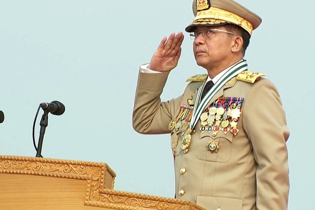 Myanmar military chief Min Aung Hlaing salutes during the Armed Forces Day parade in a screenshot from a local media broadcast. Photo: AFP
