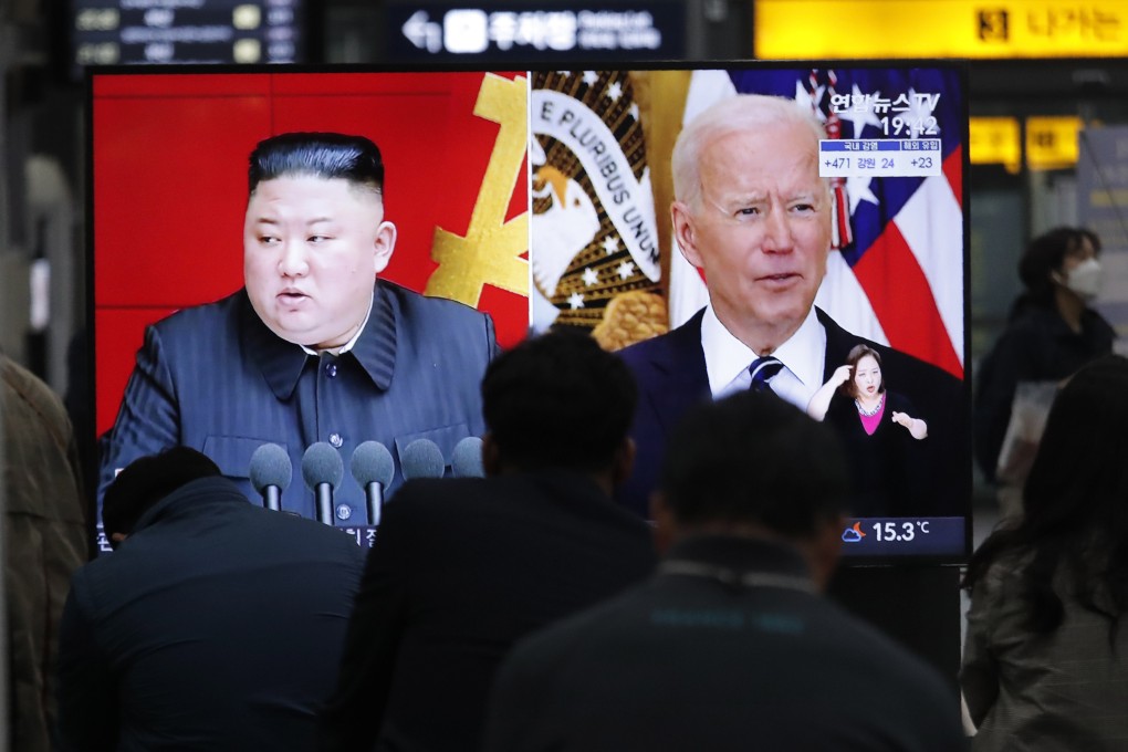 Commuters in Seoul watch a television showing a file image of North Korean leader Kim Jong-un and US President Joe Biden on March 26. Photo: AP