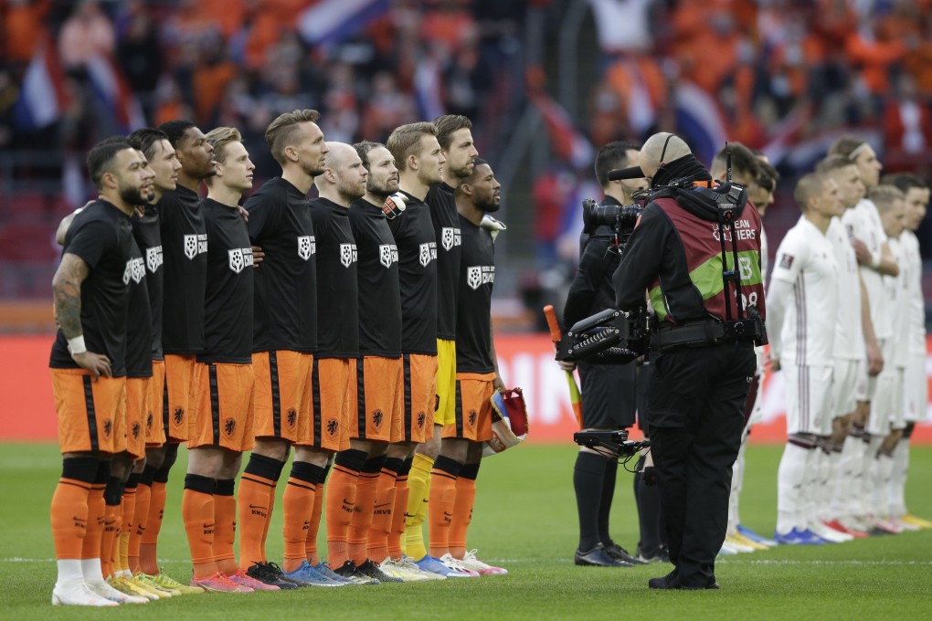 Netherlands football players wear shirts reading ‘Football Supports Change’ prior to the start of the World Cup 2022 group G qualifying match between The Netherlands and Latvia in Amsterdam on Saturday. Photo: AP