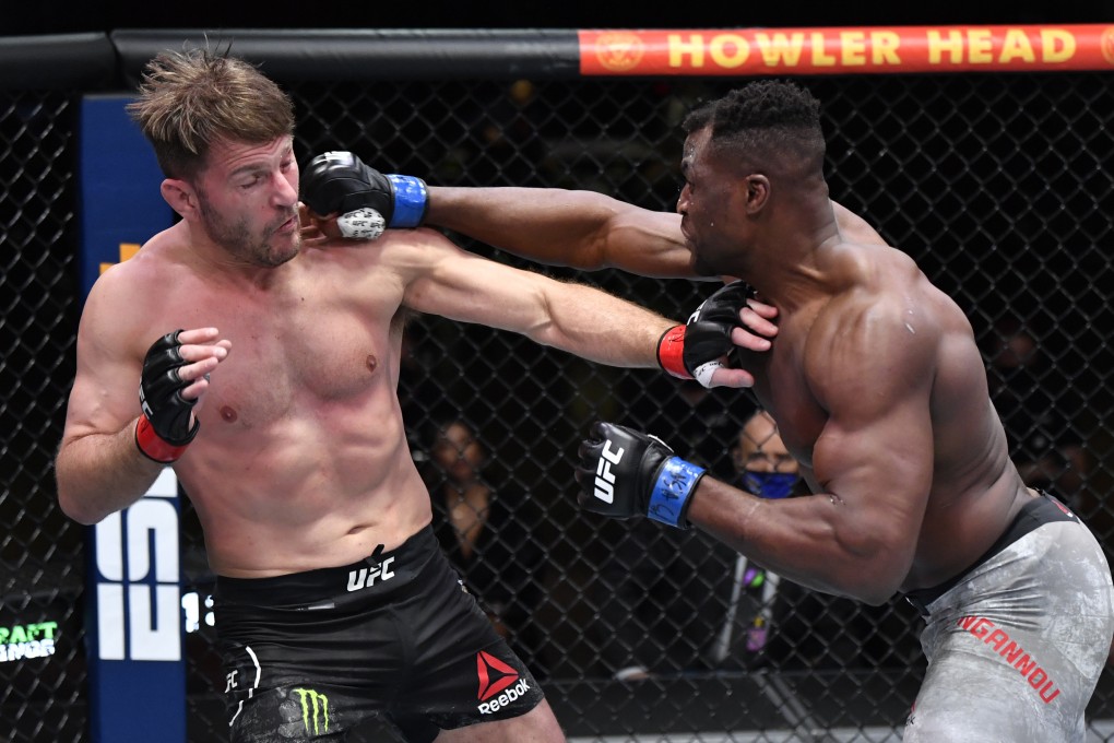 Francis Ngannou punches Stipe Miocic in their heavyweight championship fight during UFC 260. Photos: Jeff Bottari/Zuffa LLC