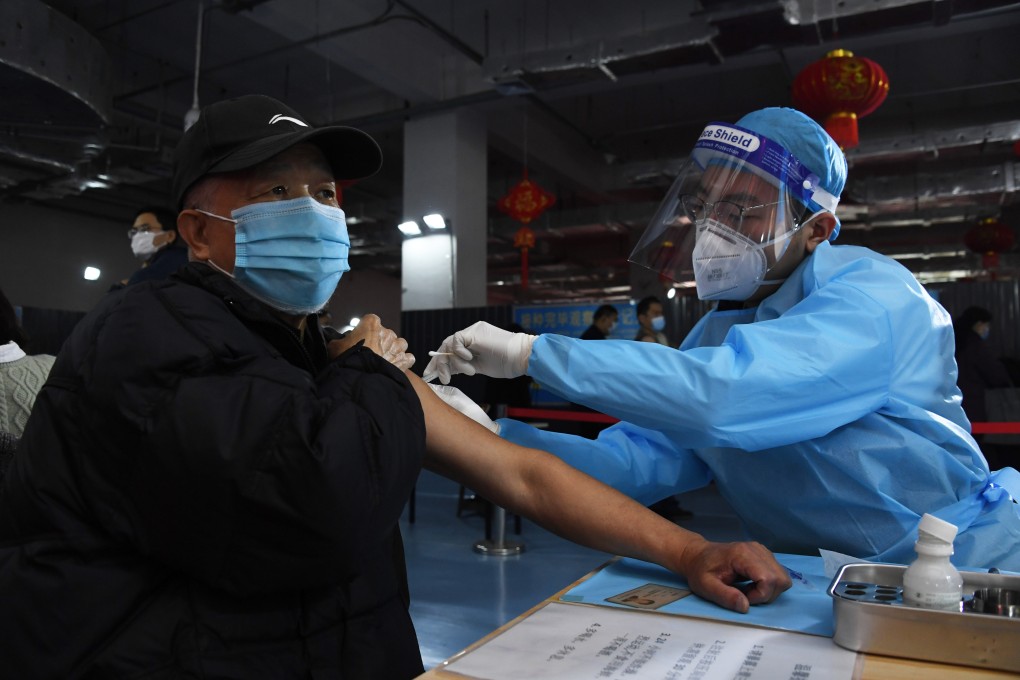 An older resident is inoculated in Beijing, where over-60s are now receiving Covid-19 vaccinations. Photo: Xinhua
