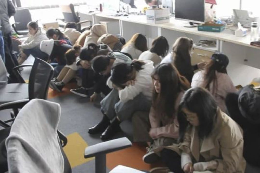 Police detain people suspected of being involved in a large illegal lending scheme in March 2019. CREDIT: Baidu