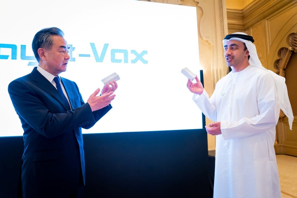 Chinese Foreign Minister Wang Yi (left) and UAE Foreign Minister Abdullah Bin Zayed Al Nahyan launch the joint Sinopharm vaccines production line in Abu Dhabi, United Arab Emirates, on Sunday. Photo: Reuters