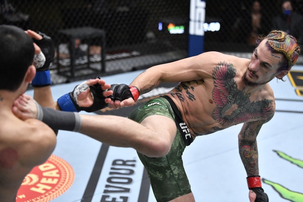 Sean O’Malley kicks Thomas Almeida in their bantamweight bout at UFC 260. Photo: Jeff Bottari/Zuffa LLC