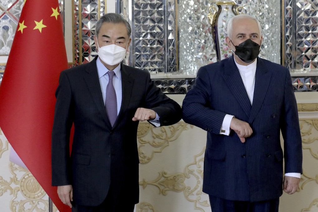 China’s Foreign Minister Wang Yi poses with his Iranian counterpart Mohammad Javad Zarif in Tehran on Saturday. Photo: AP