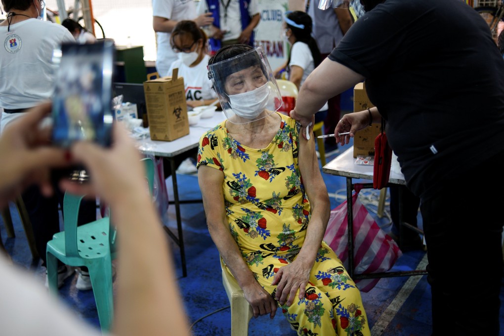 A woman receives her first dose of the AstraZeneca Covid-19 vaccine in Manila, Philippines. Photo: Reuters