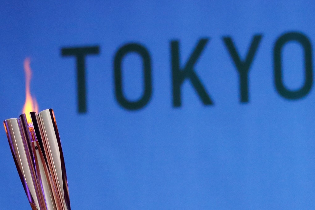 FILE PHOTO: The Olympic torch is seen at Hibarigahara Festival Site, during the last leg of the first day of the Tokyo 2020 Olympic torch relay, in Minamisoma, Fukushima prefecture, Japan, March 25, 2021.  REUTERS/Issei Kato/File Photo