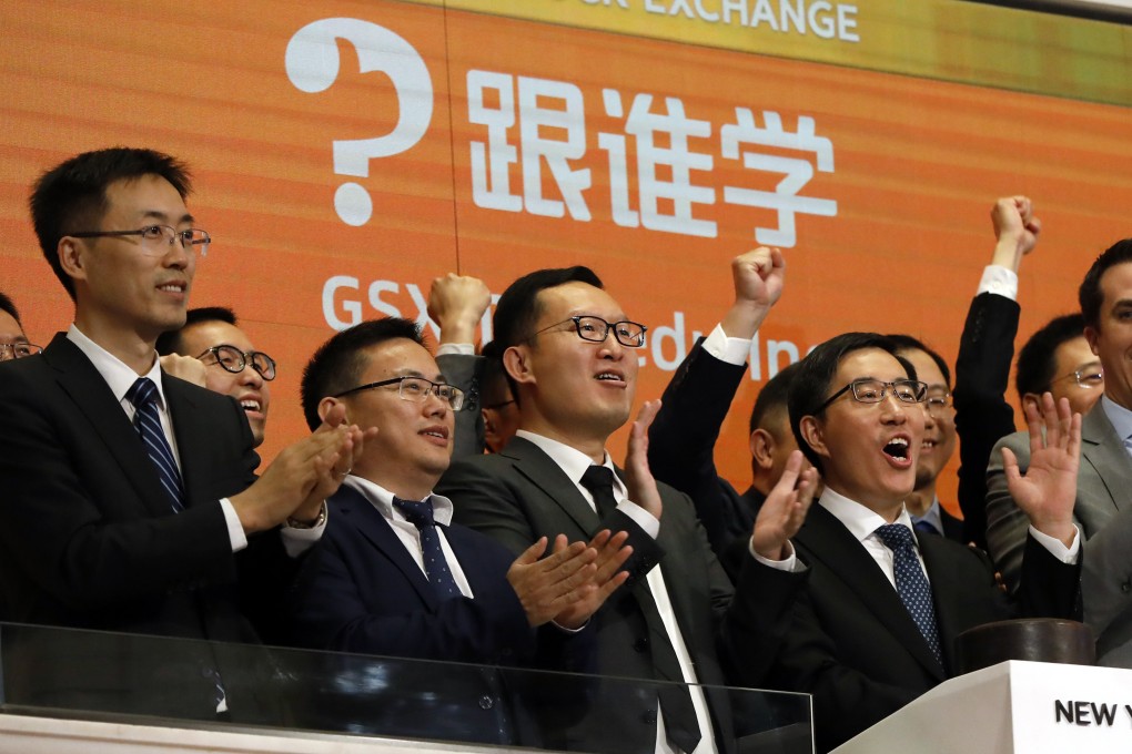 GSX Techedu chairman and CEO Larry Chen Xiangdong (right), along with members of the company’s leadership team, celebrate their IPO as they ring the New York Stock Exchange opening bell on June 6, 2019. Photo: AP Photo