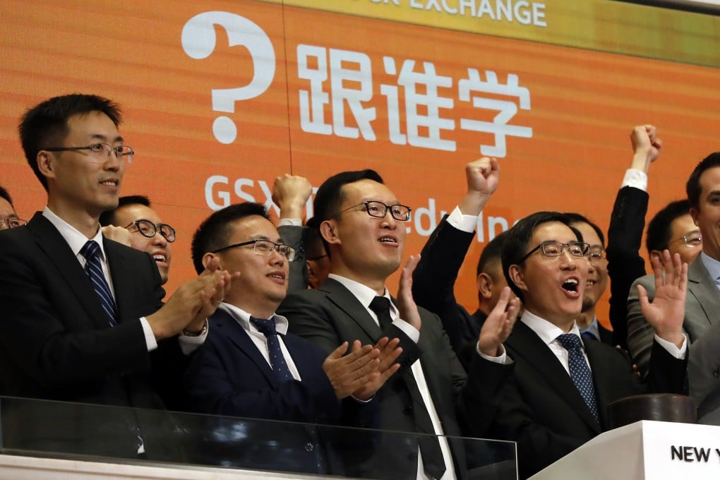 GSX Techedu chairman and CEO Larry Chen Xiangdong (right), along with members of the company’s leadership team, celebrate their IPO as they ring the New York Stock Exchange opening bell on June 6, 2019. Photo: AP Photo