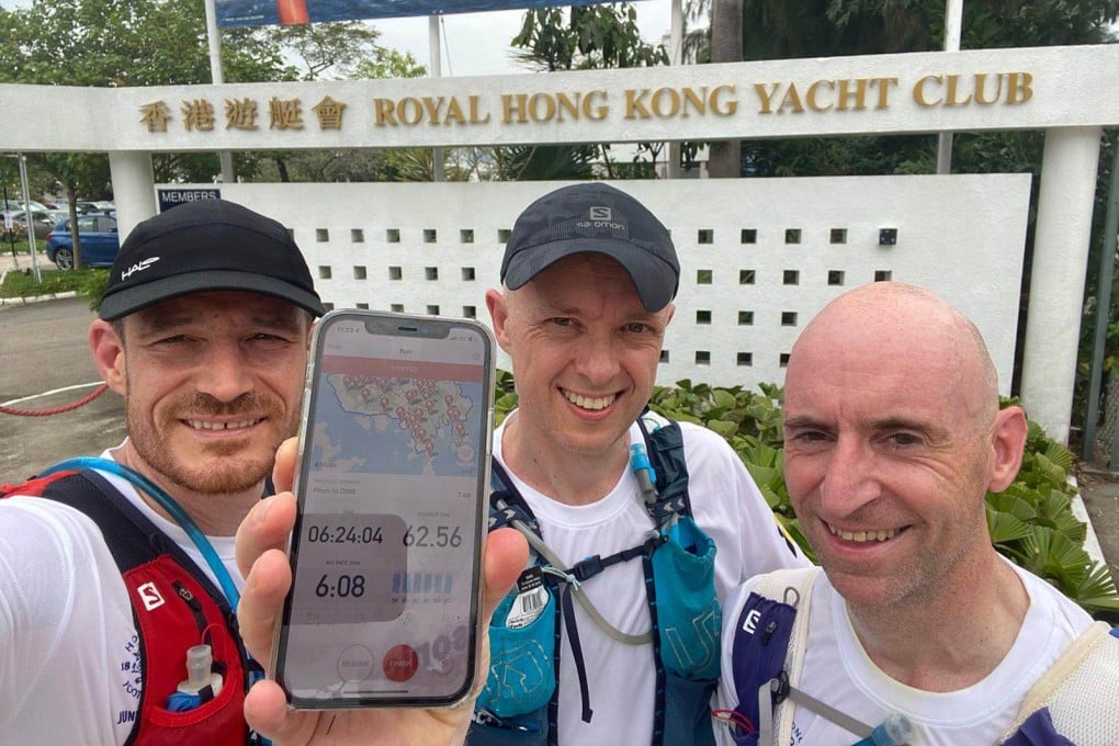 Andy McGirr, Martin Cerullo and Keith Williamson show off their time after completing the loop. Photo: Handout